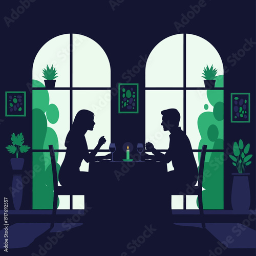 Silhouette of a couple enjoying a romantic dinner date.