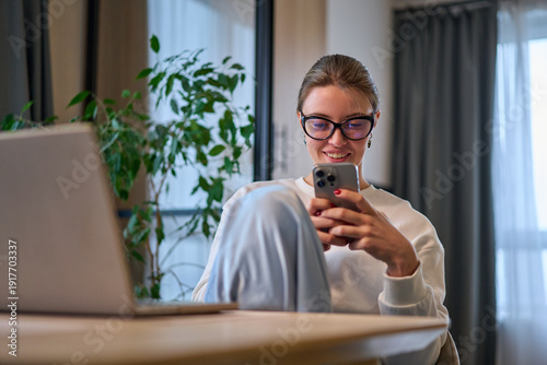 Relaxed Break With Her Feet Up in a Sunlit Dining Space