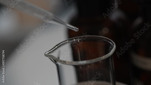 Perfume making process of dropping raw materials and blending into a flask