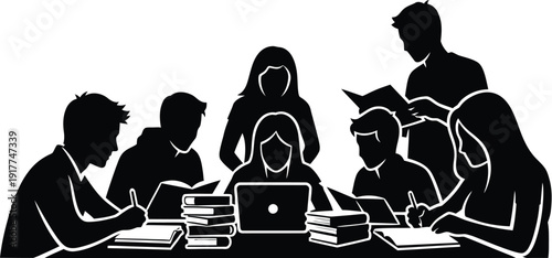 Silhouette of students studying together at table with laptop and books