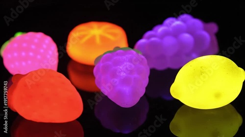 Vibrant glow-in-the-dark fruits in colorful array