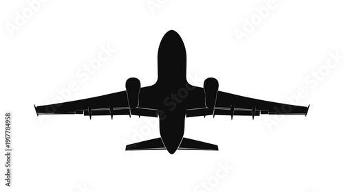 Silhouette of an airplane flying over a clear sky