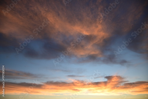 stunning view of a sunrise between fog ans sky