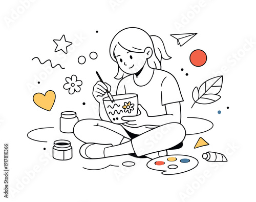 Flower pot creative painting. A girl sitting on the floor painting simple patterns on a white flower pot,