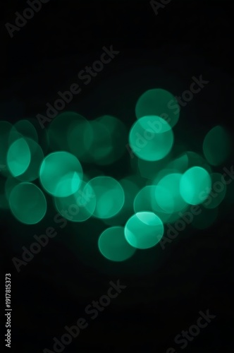 A mesmerizing display of glowing green orbs in a dark environment