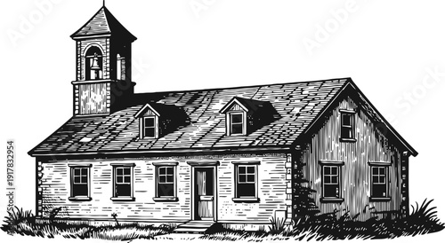 Vintage rural schoolhouse with bell tower and dormer windows in black and white