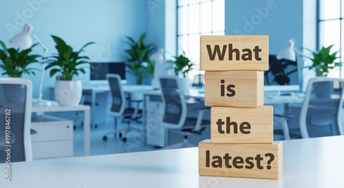 Modern Office Scene Featuring Wooden Blocks Asking 'What Is The Latest?'