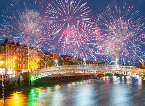 Canvas Print Ha'Penny Bridge at twilight blue hour with fireworks - Dublin, Ireland
