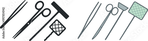 A collection of crafting tools is displayed on a flat surface. The tools include scissors, tweezers, and a cleaning implement, ideal for detailed work and projects.