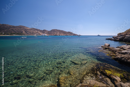 Ios, Greece - September 9, 2025 : Wonderful view of the see trough turquoise beach of Mylopotas in Ios Greece
