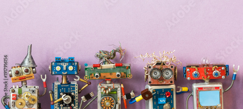 Five happy toy robots waving hands up, lined up. Crafted from electronic parts, circuit boards, springs, plastic, gears and wires. Friendly robot toy flyer, creative design leaflet, collectible card