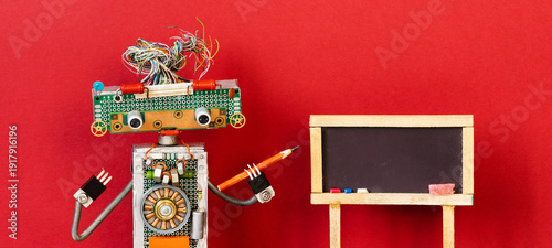 Amusing robot educator with wire hair holding pencil pointer beside blank blackboard. Classroom concept, teaching flyer, training leaflet
