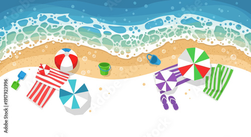 Beach scene with beach balls and umbrellas on sandy shore.