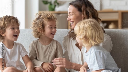 Heartwarming Mother’s Day Family Scene – Smiling Mother Surrounded by Joyful Children in Cozy Modern Living Room