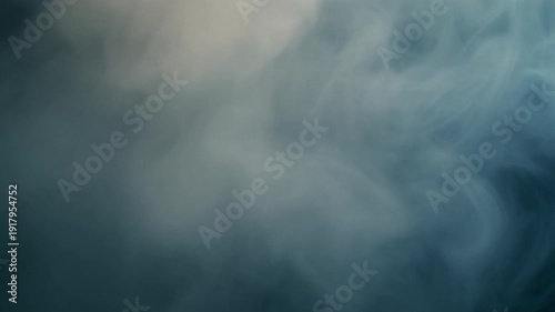 Foggy mist swirling over a dark blue landscape viewed from a high vantage point, capturing the eerie atmosphere and natural scenery