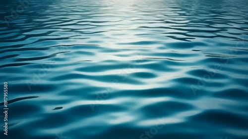 Serene ocean waves gently rippling under soft sunlight from a high vantage point