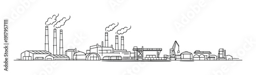 Industrial factory complex with smokestacks along waterfront