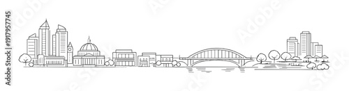 Urban skyline with bridge and riverside buildings in grayscale