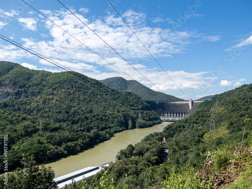 Large Concrete Hydroelectric Dam and High Voltage Lines.