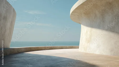 Fototapeta samoprzylepna Modern architectural structure overlooking serene ocean under a clear, bright sky
