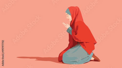 Woman in red hijab kneeling and praying with hands together on a plain pink background