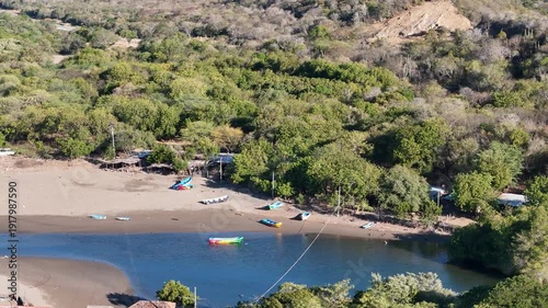 Boats and trees by the river in a small town