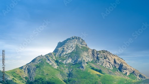 green mount peak on a sunset time lapse scene