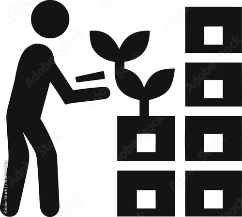 A person plants a small green sprout into a modular vertical garden system