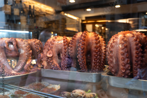 Galician octopus displayed in the window of a restaurant in Santiago de Compostela, Galicia, Spain