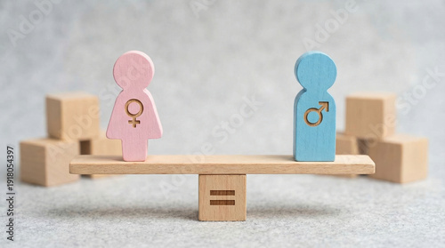 Conceptual wooden male and female figure on seesaw scale representing gender equality concept with fairness and equal right opportunity between man and woman symbol regarding business and harmony