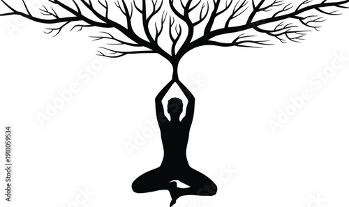 Person in yoga pose under tree branches in black silhouette