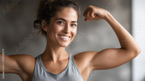 Portrait of smiling strong woman on wall, confident female strength display, powerful feminine portrait, muscular woman showcase, athletic empowerment, defocused background, with copy space Free Download Portrait of smiling strong woman on wall, confident female strength display, powerful feminine portrait, muscular woman showcase, athletic empowerment, defocused background, with copy space - GFXLoad