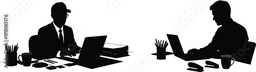 Two business professionals working at their desks in silhouette