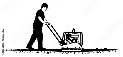 Construction worker operating a vibratory plate compactor on ground surface