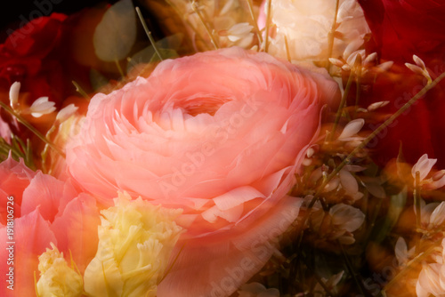 A vibrant macro photograph captures a fresh flower bouquet with motion blur and shallow depth