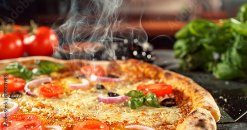 Close-up of a freshly baked pizza with melted cheese and golden crust in warm, appetizing light. Classic comfort food concept with rich texture and inviting presentation.