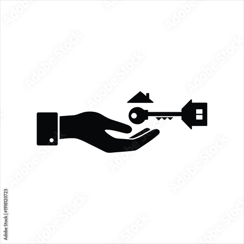 Hand offering a house key to another hand, symbolizing home ownership or real estate transaction.