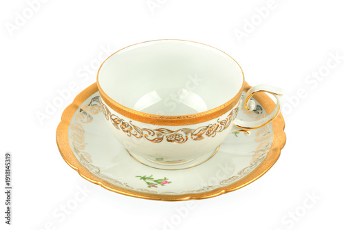 Elegant vintage porcelain teacup and saucer with gold filigree pattern