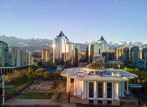 Obraz na płótnie Aerial view of Almaty city skyline with mountains in the background