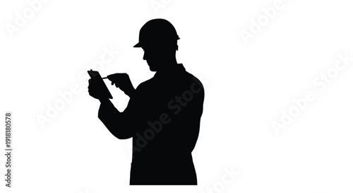Silhouette of a construction worker examining plans or a tablet on a white background