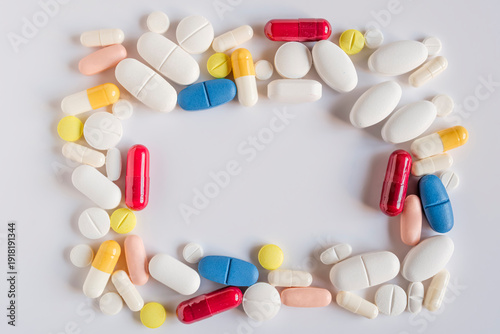 Tablets and pills of different types and colors.