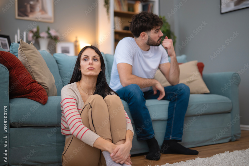 Fototapeta premium Couple experiencing conflict and relationship problems at home