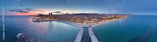 Photography Barcelona city lights panorama at sunset over Mediterranean sea