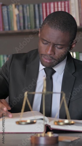 Wallpaper Mural African American Lawyer Reading Law Book before Court, Vertical Video Torontodigital.ca