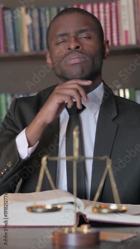 Wallpaper Mural Pensive African American Lawyer Reading Book in Office, Vertical Video Torontodigital.ca