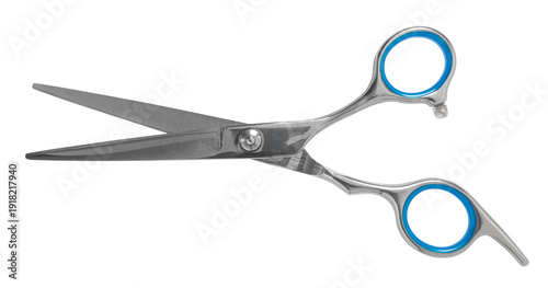 Hairdressing scissors close-up on a white isolated background