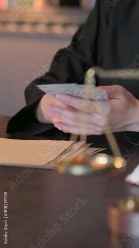 Wallpaper Mural Close up of Female Lawyer Counting Money, Vertical Video Torontodigital.ca