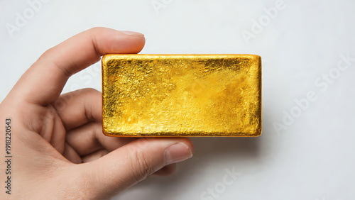 Hand Holding Gold Bar White Background