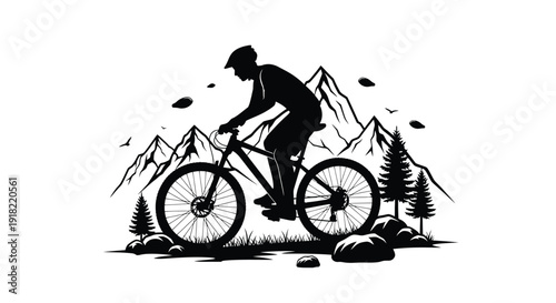 Silhouette of a mountain biker riding through a rugged landscape