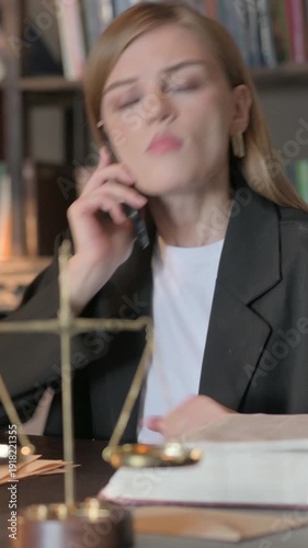Wallpaper Mural Upset Female Lawyer Arguing on Phone in Office, Vertical Video Torontodigital.ca